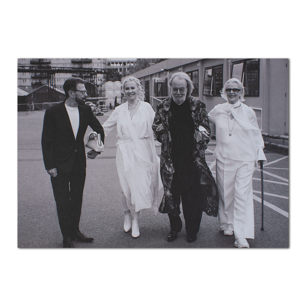 Four people in formal attire outdoors, promoting the ABBA Voyage Brochure Bundle